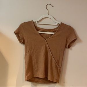 Low v-neck, cross shirt